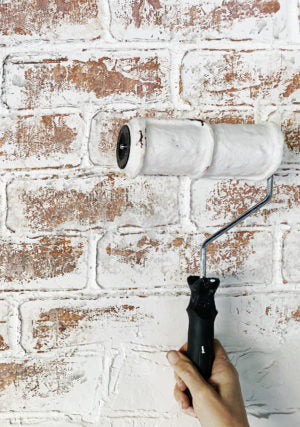 IOD Brick Texture Roller in use on wall